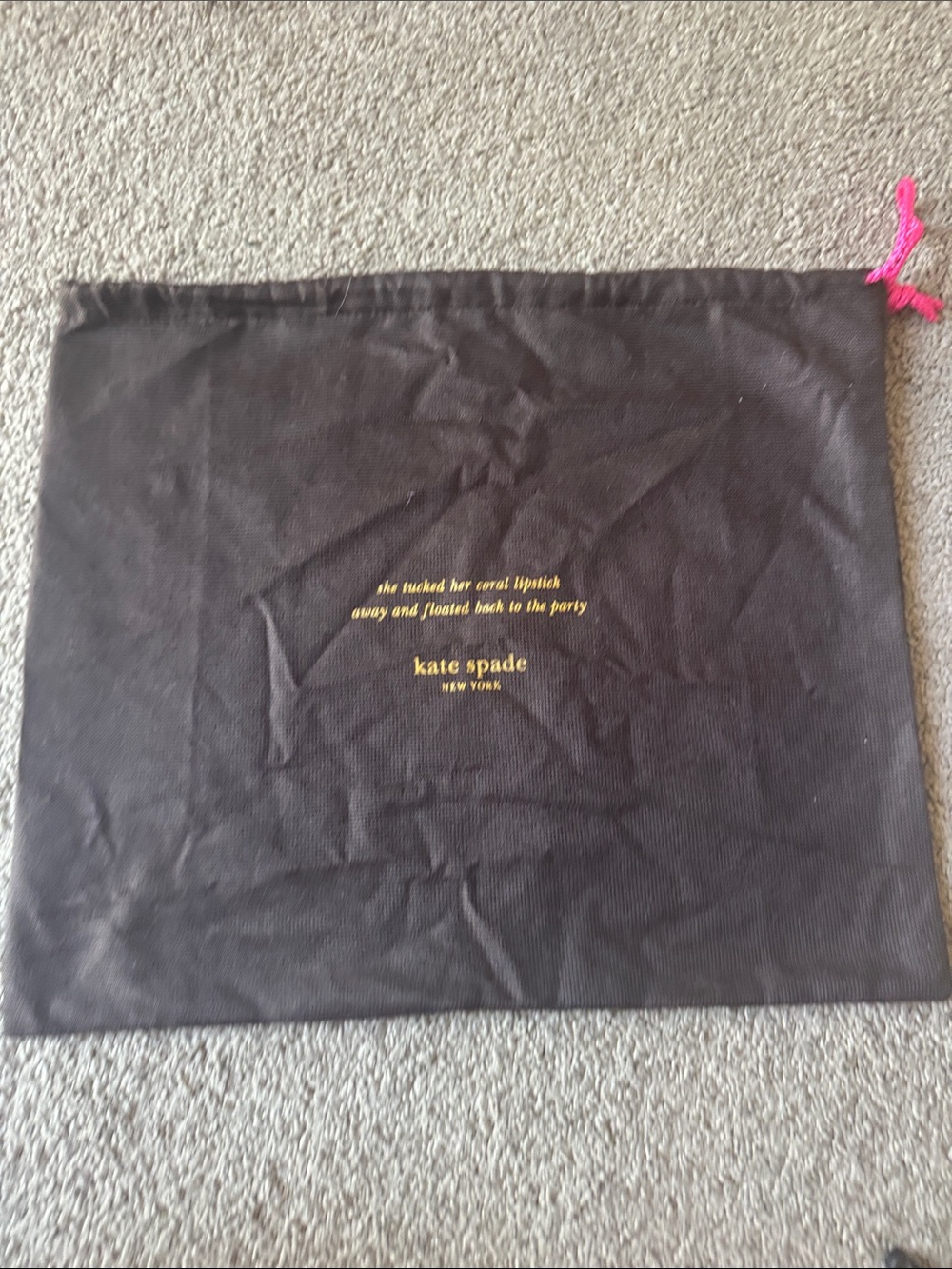 kate spade black dust bag with gold logo and pink drawstring